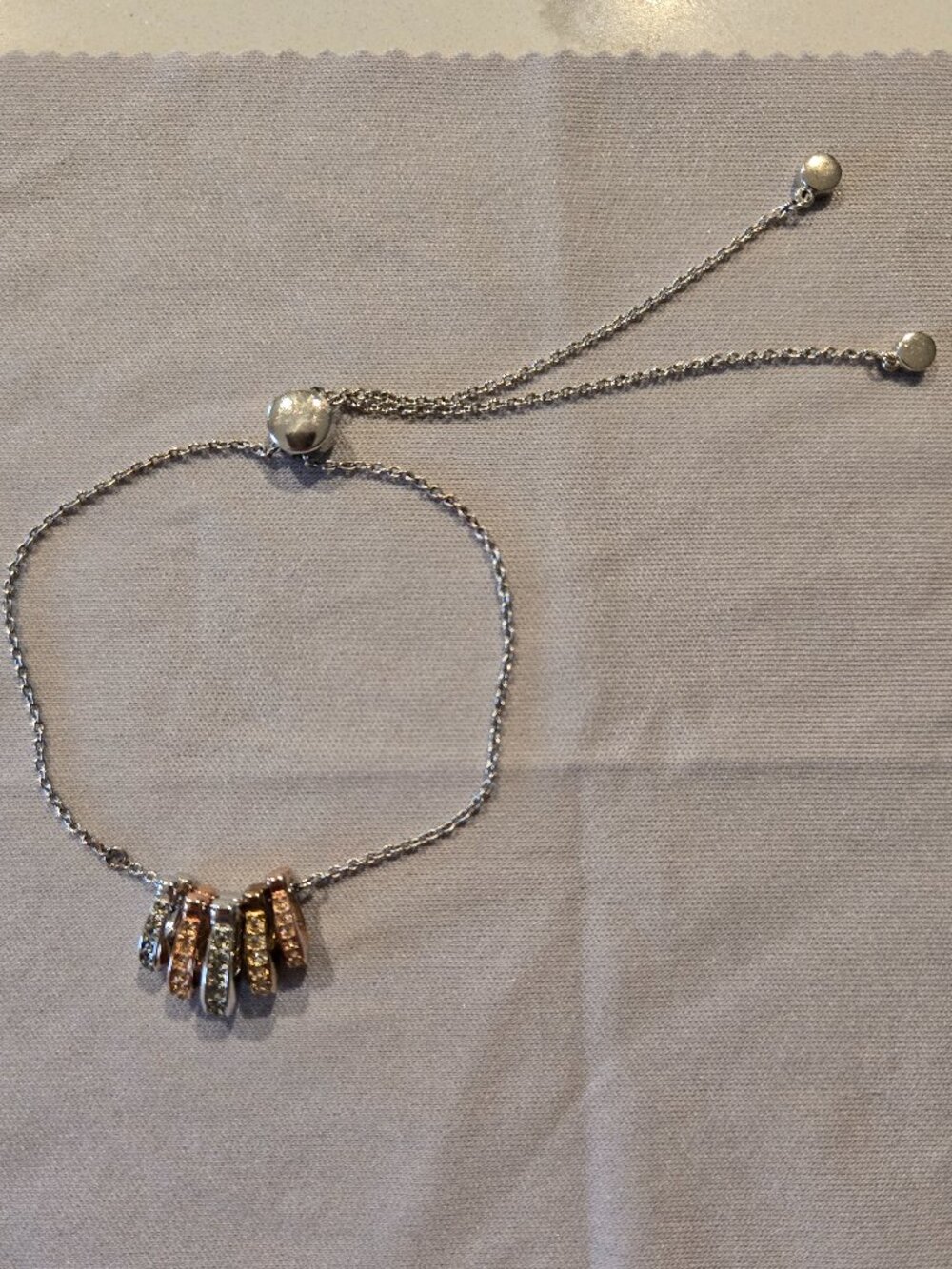 COACH slider charm C bracelet multi tone